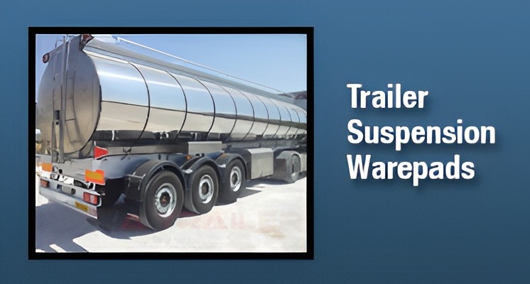 Polished stainless steel tanker trailer showcasing its suspension system. Relevant for discussions on trailer components and maintenance.
